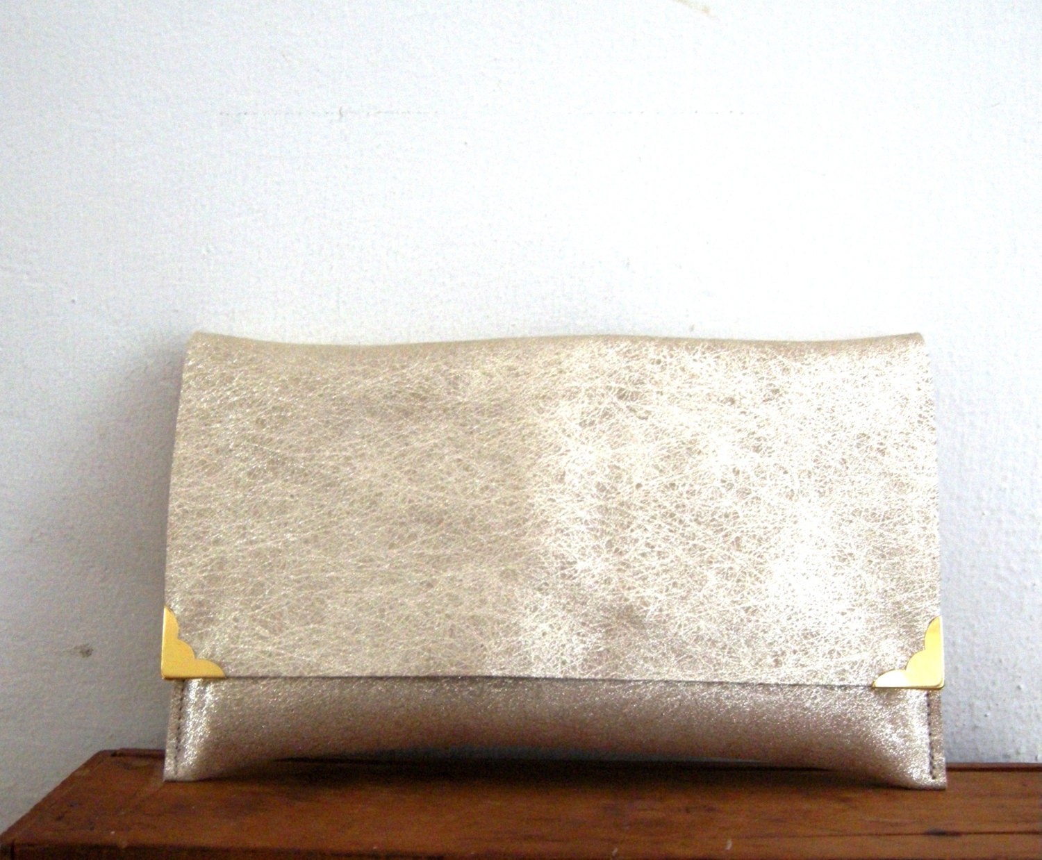 Gold leather clutch