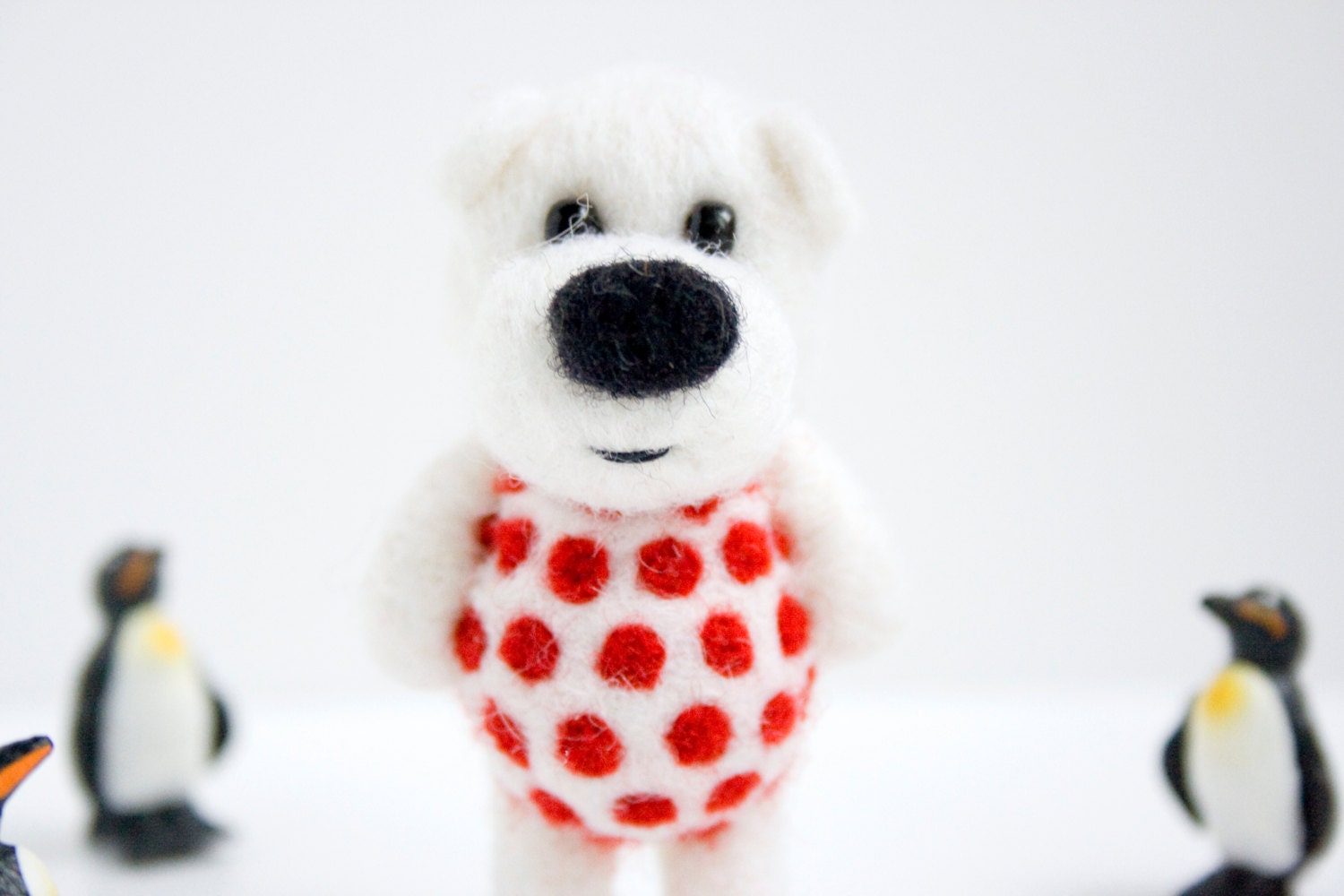 White felted pocket bear with red polka dots