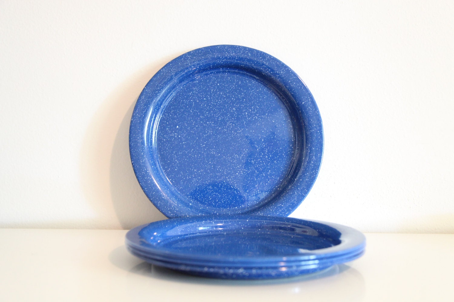 vintage set of four blue tin plates