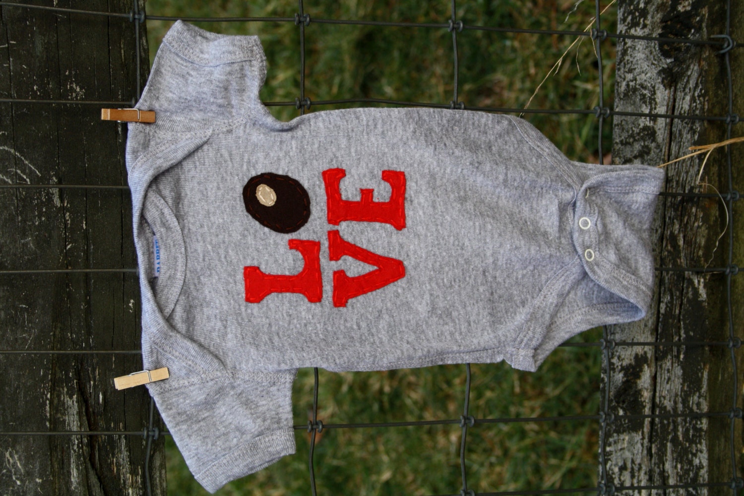 Grey Buckeye/Ohio LOVE onesie, red Love letters with a buckeye as the "O"