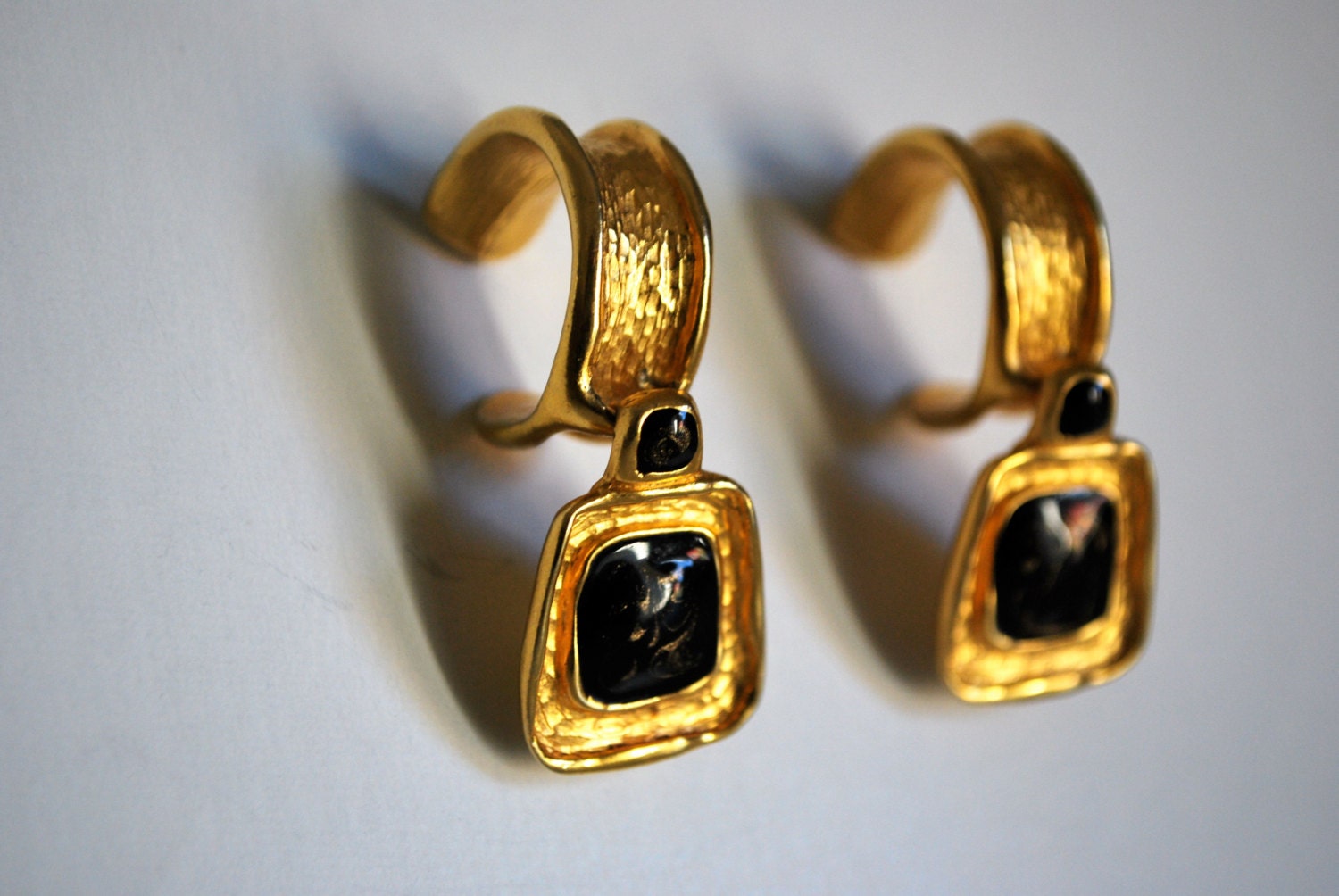 Gold Dangle Earrings With Black Enamel