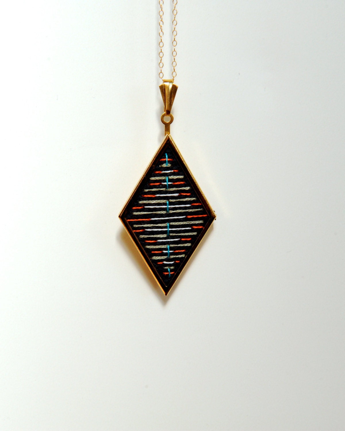 gold geometric diamond shaped necklace // cross stitched x // colorful