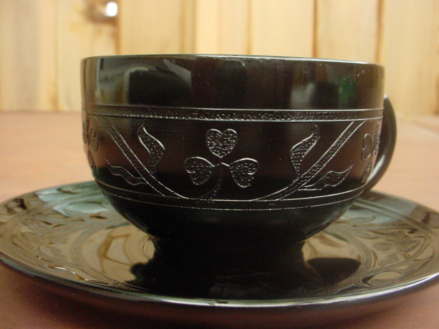 Embossed Black Amythyst Tea cup and saucer .