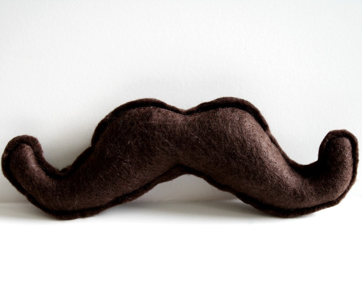 The Wilford Brimley felt catnip brown mustache cat toy