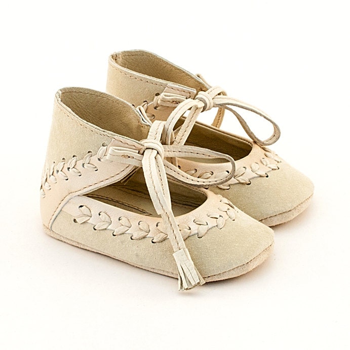 Beige leather baby shoes with leather stitch embellishment