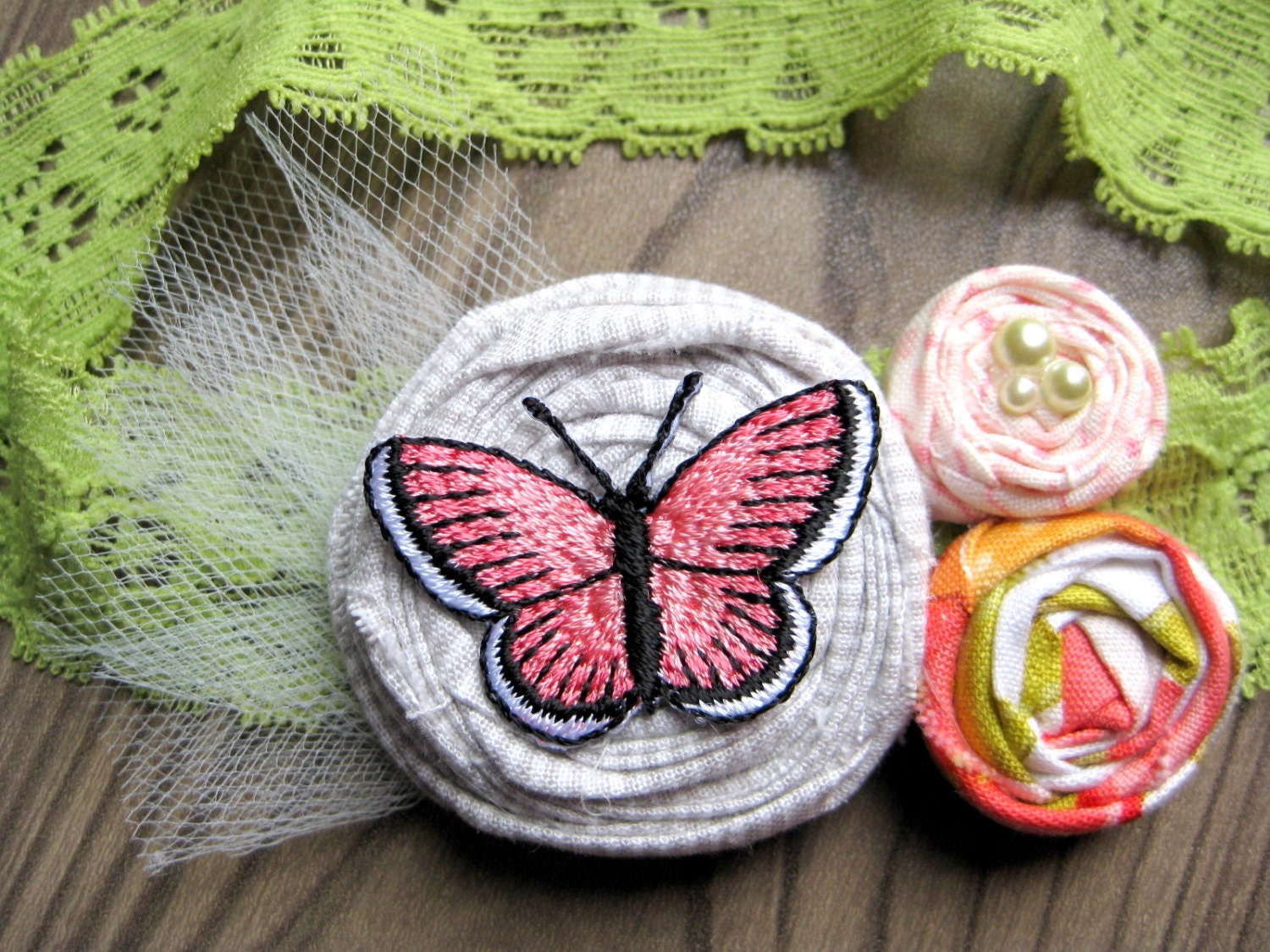 Stretch Lace Headband - green / coral rosettes with butterfly