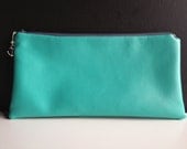 large turqouise faux leather bag with anchor zipper