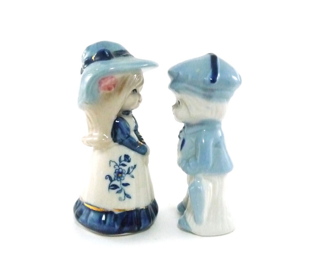 Little boy and girl figurines in blue and white
