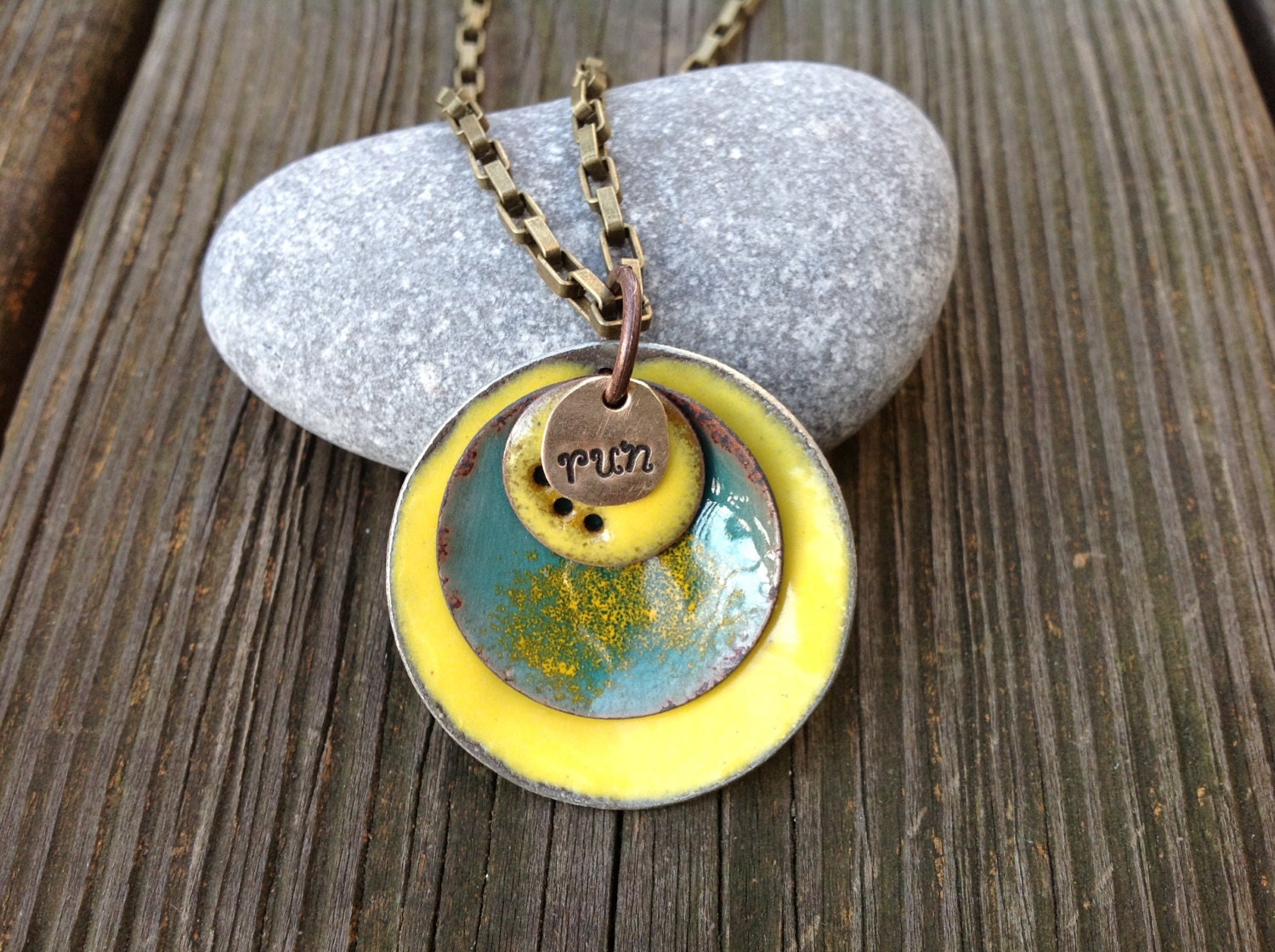Running necklace large silver enameled disc with yellow, blue stamped "run"