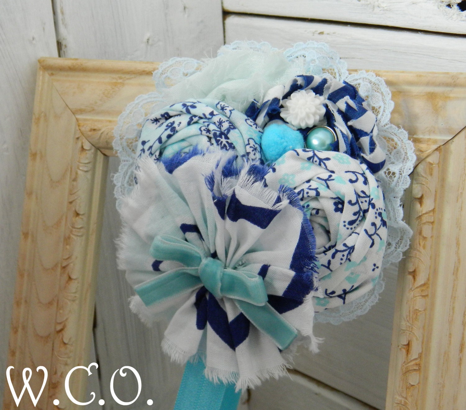 the CYANEA Fabric Rosette and Chiffon Flower Headband or Hair Clip in Shades of Blue