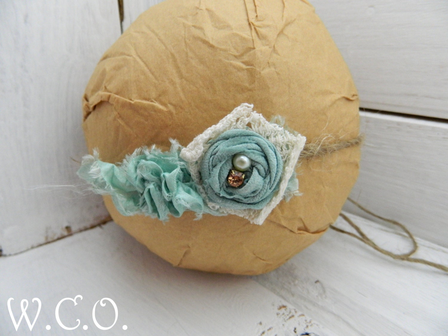 the MOIRA Silk Sari Ribbon Ruffle and Rosette Jute Tieback with Vintage Lace
