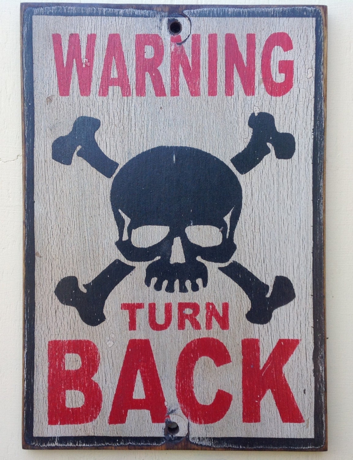 Warning turn back sign made from reclaimed plywood