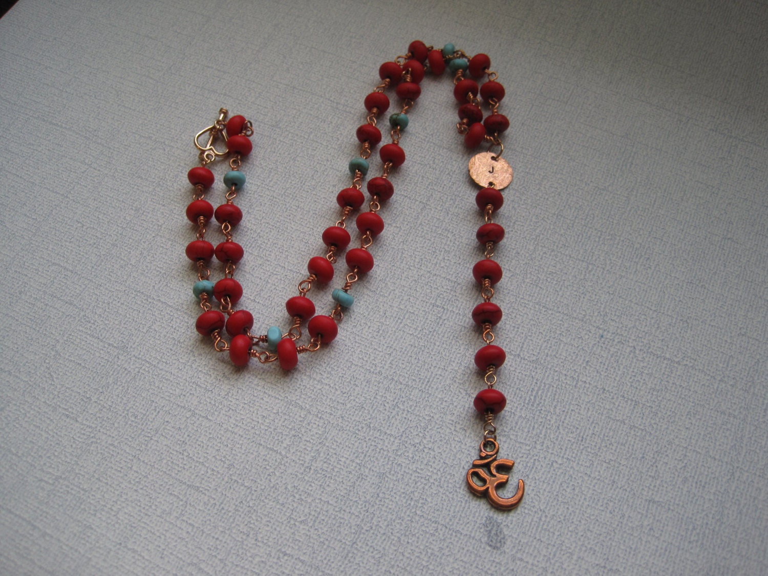 Rosary necklace inspired by Yolanda of Real Housewives of Beverly Hills red and blue howlite copper handstamped disc & OM charm