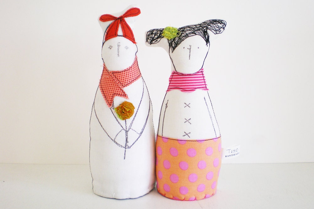Lovers dolls, children, best friends, he in a Coral hat And Peach scarf holding gold  flower she with pigtails and dotted  skirt