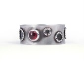 Sterling silver and garnet ring with circles, handmade artisan jewelry with red gemstone, MADE TO ORDER