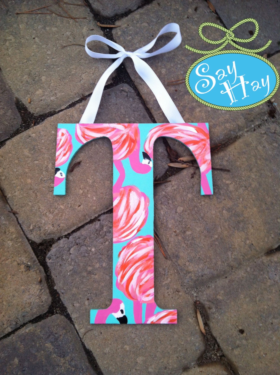 Hand painted T hanging from ribbon inspired by Lilly Pulitzer flamingo print for Monogram