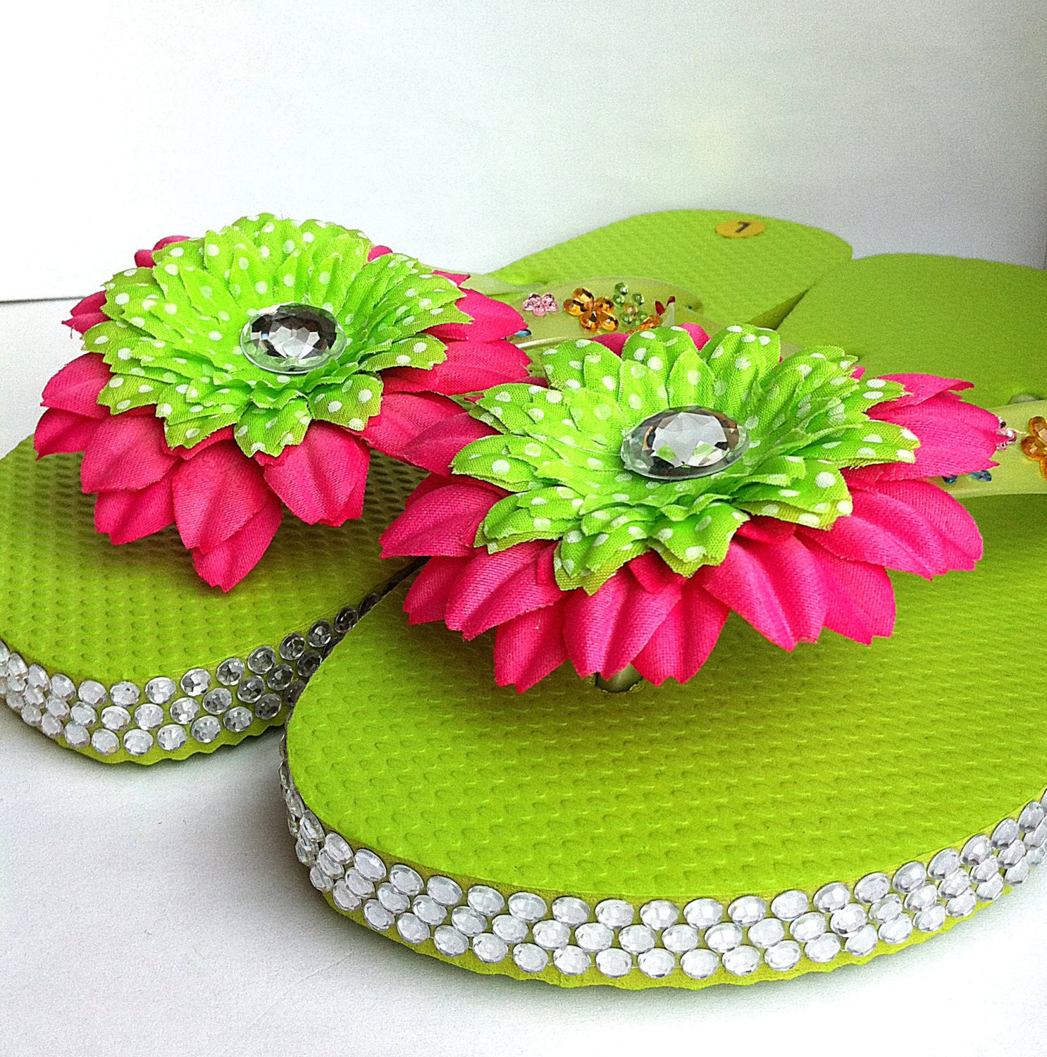 Cute neon green childrens blinged flip flops with hot pink flowers, size Large,thongs,slippers,beach wear,spa shoes