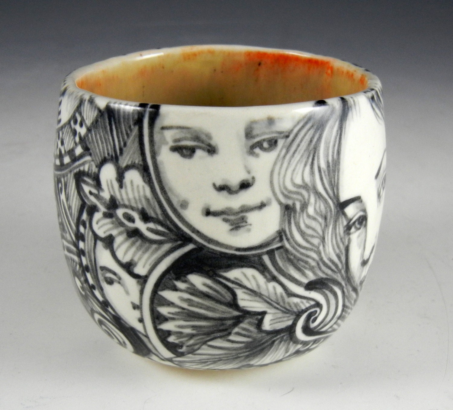 Black and white porcelain tea bowl/ cup with  eye, rabbit ,faces and imagine