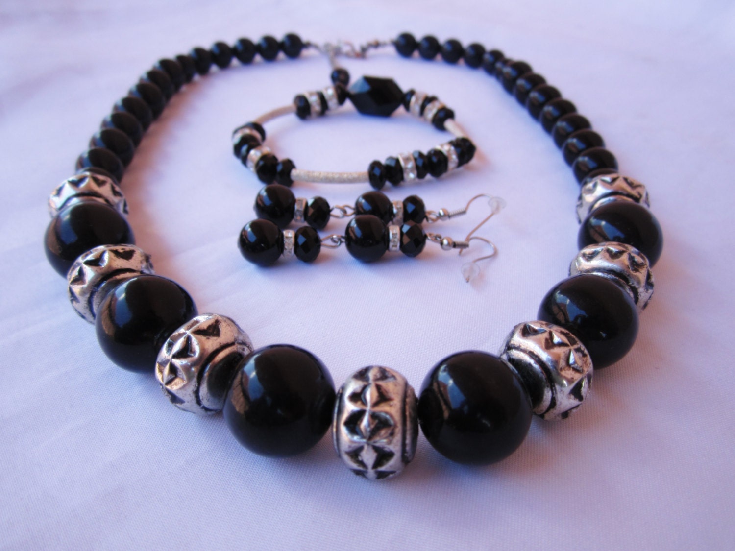 Onyx color acrylic beaded with silver charm accented necklace with matching beaded bracelet and dangle fashion beaded earrings