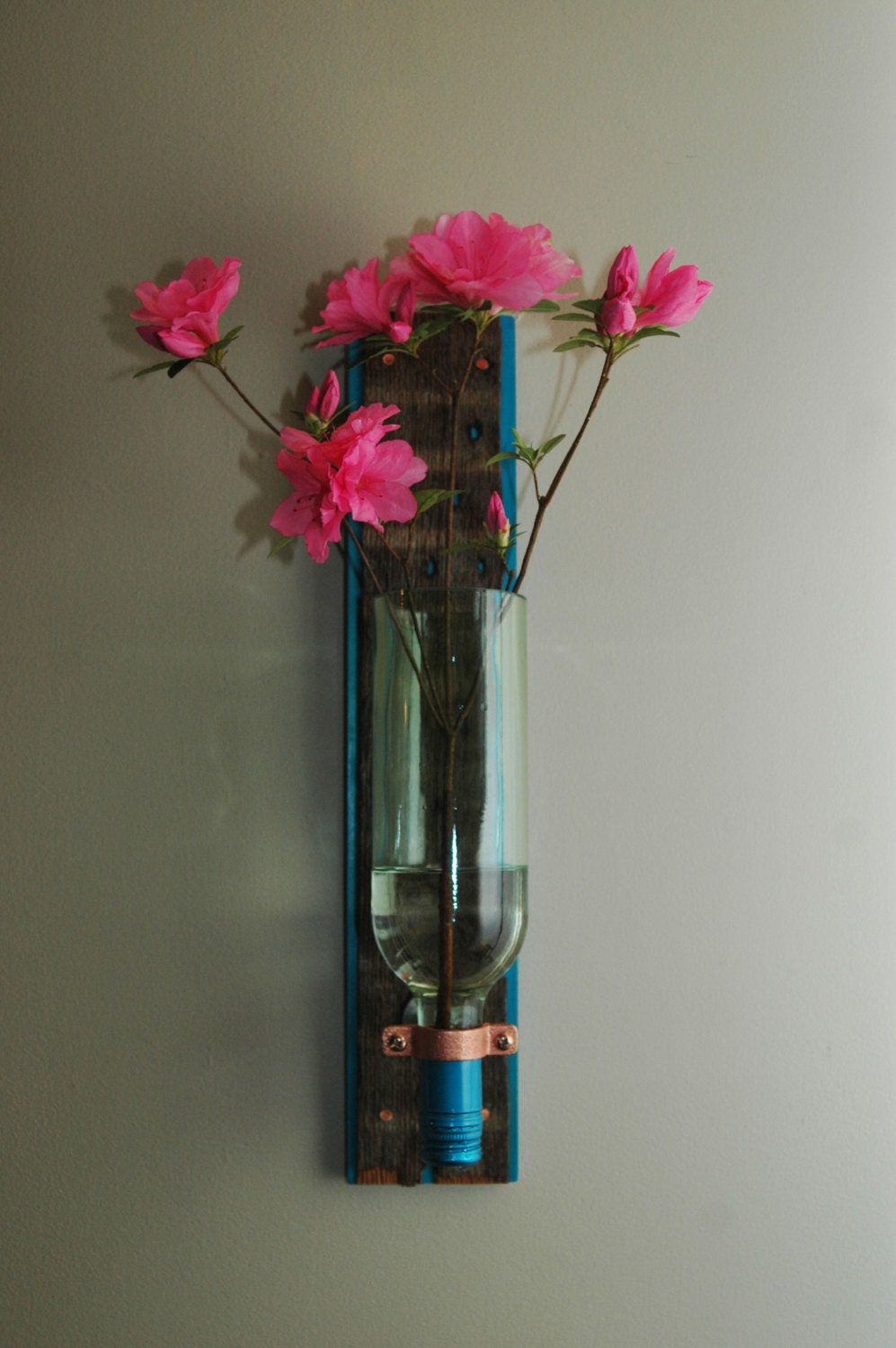 floating vase made from recycled wine bottle and repurposed wood
