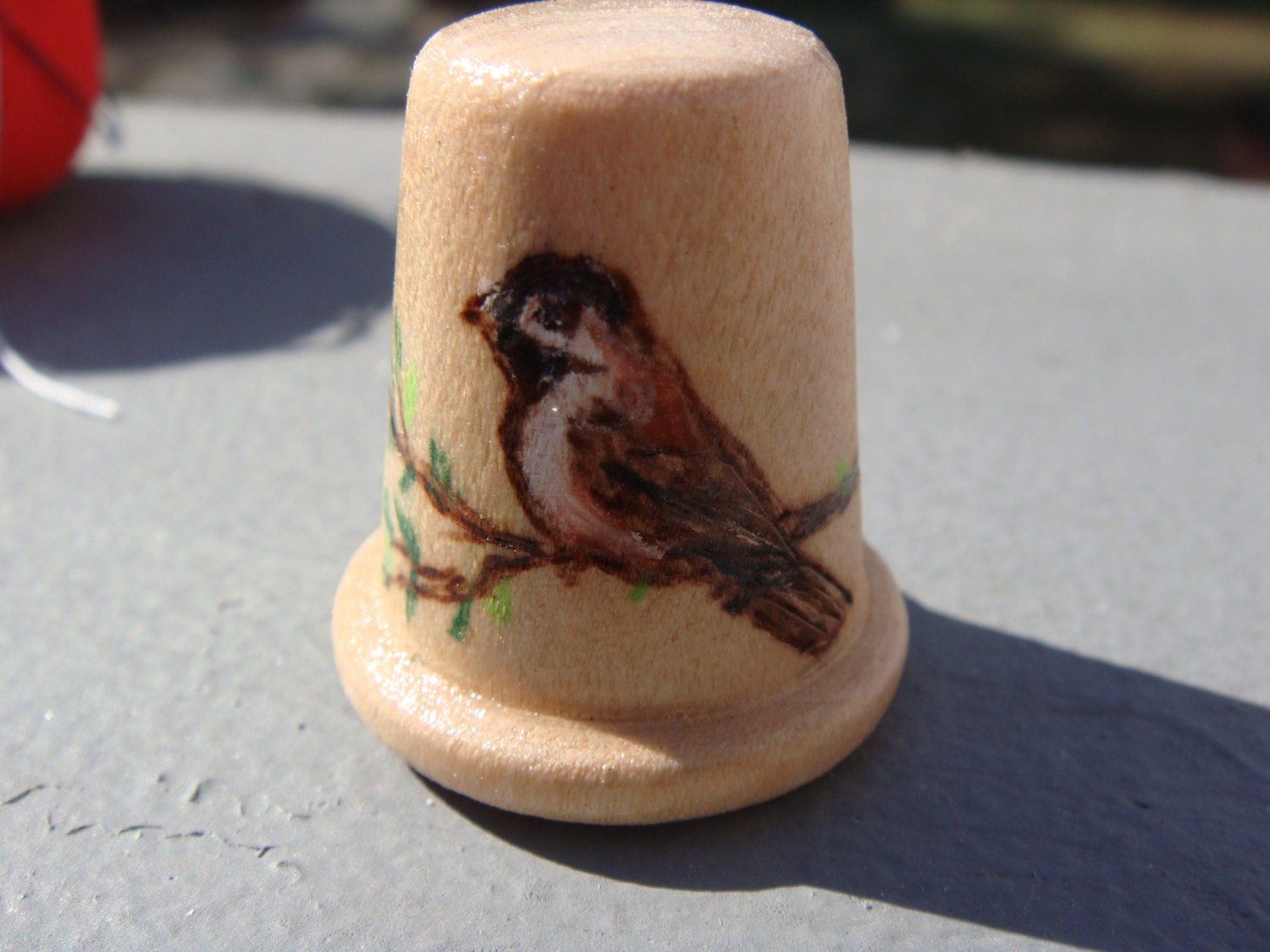 wooden thimble with woodburned chickadee design