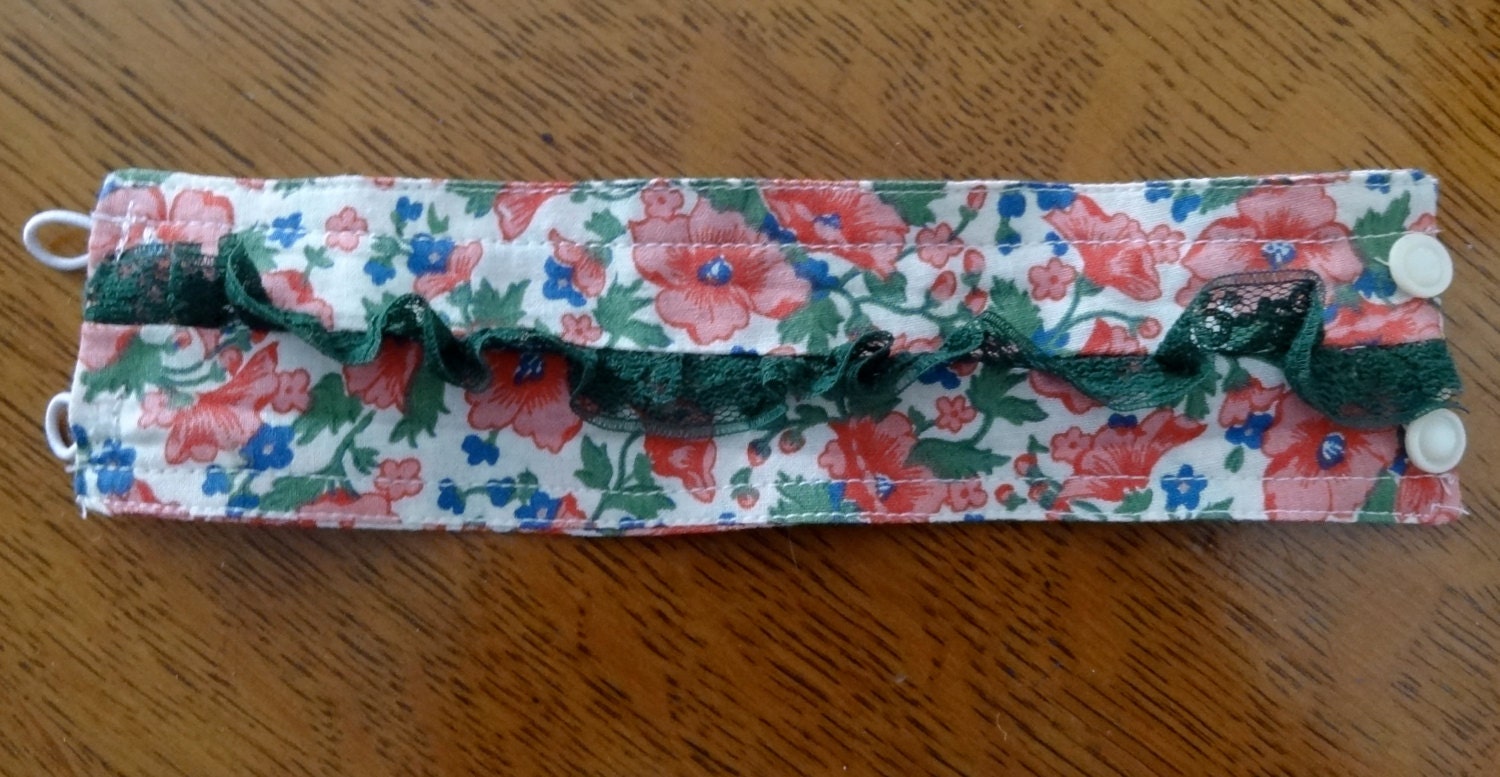 Bracelet cuff of vintage calico fabric, lace and mother of pearl buttons pink green white blue