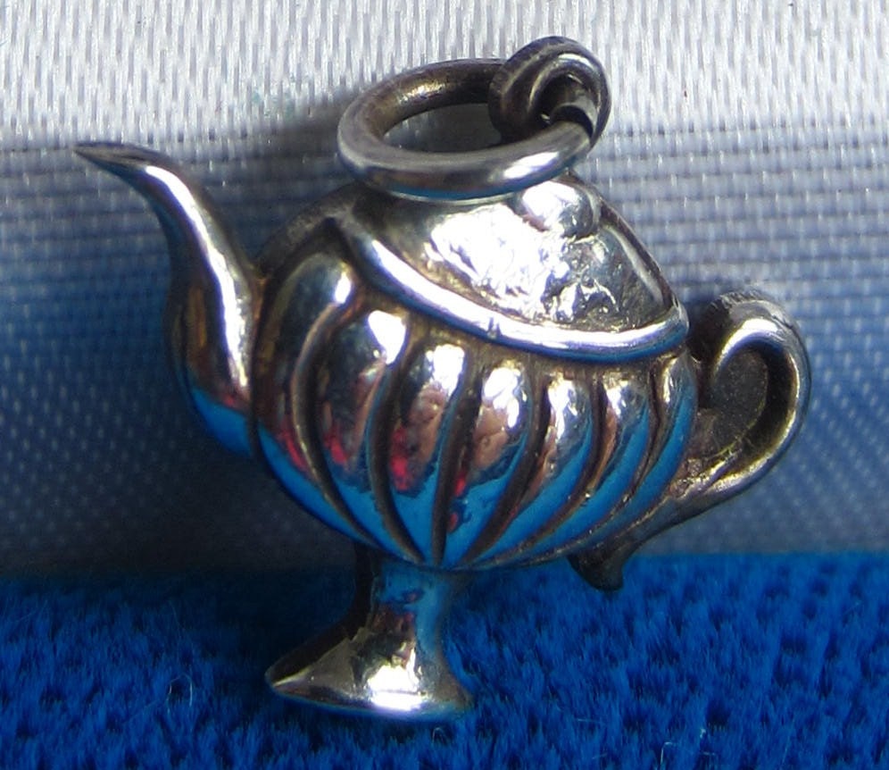 Sterling silver teapot charm signed "birks sterling"