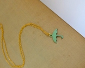 Rain.  Mint Green Umbrella. Gold Necklace.