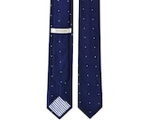 Nova: a navy cotton spotted necktie
