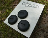 Three one inch ebony wood buttons