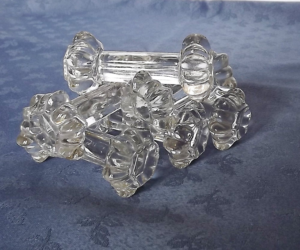 Six glass knife rests, made in France