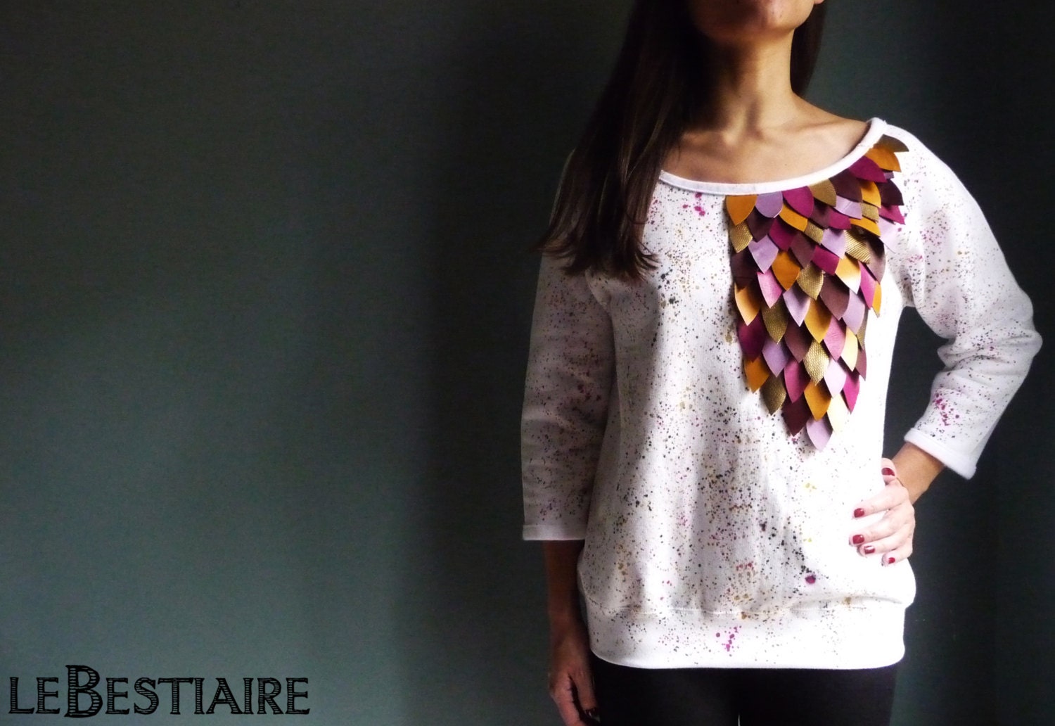 White flecked cotton sweat shirt embroidered with leather feathers