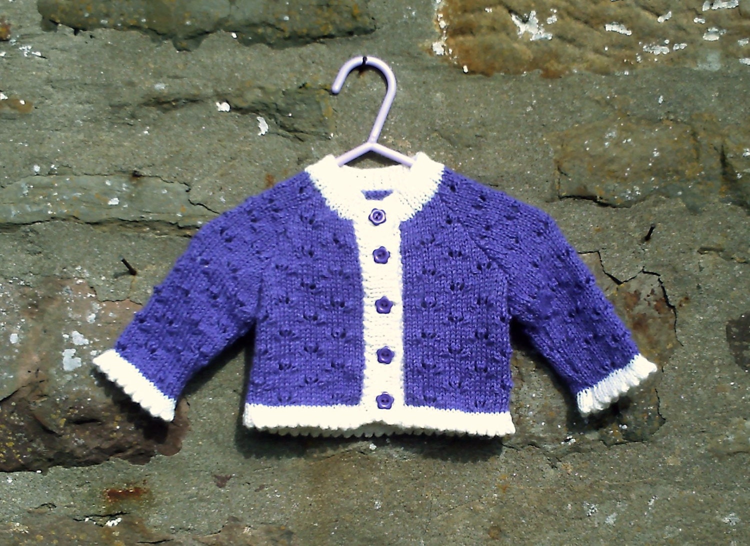 Hand knitted baby girls purple and cream trim cardigan and hat set. 16" chest