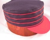 Box cap with soutache, soft wool flannel with supple leather sweatband, size 7 1/4, other sizes available.