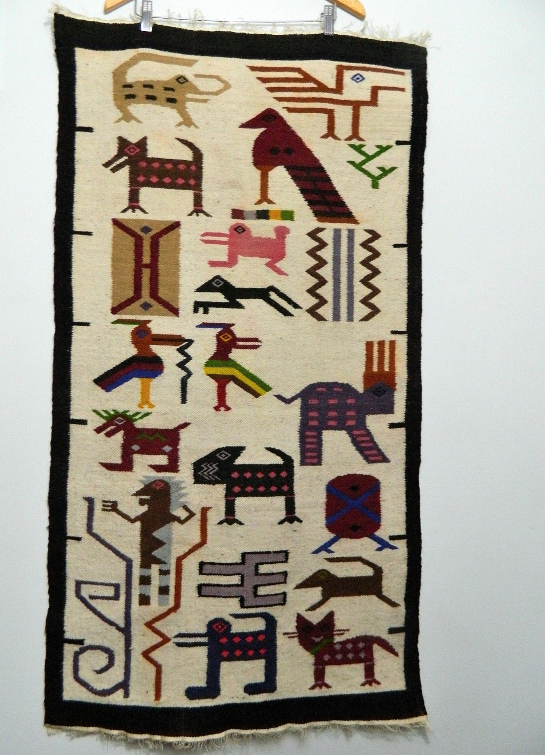 ethnic woven wall hanging . rug . south american . native . tribal peru . animals birds
