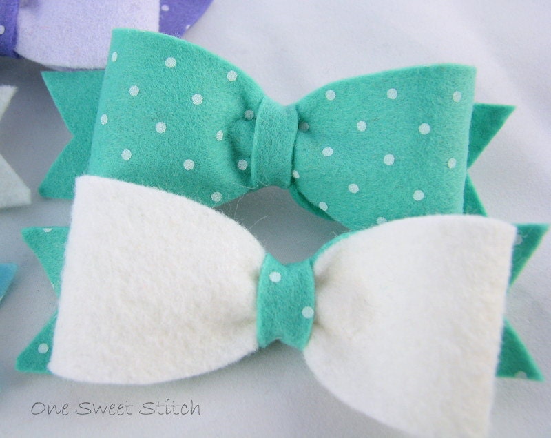 blue and white felt bow barrettes attached to a snap clip barrette