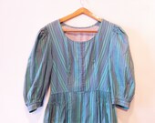 Vintage dirndl dress in teal and lilac with apron