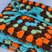 Roaring dino crochet baby blanket, granny square reversible crochet baby blanket