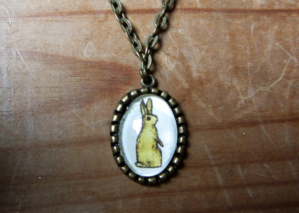 Yellow Rabbit - Illustrated oval pendant - bronze antique - vintage style