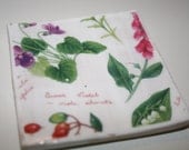 Handmade porcelain ceramic tile coaster, in clear glaze with garden flowers and script design