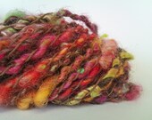 Cuddle me. Art yarn. Core spun and bubble plied. Autumn colours. Soft and smoochy goodness of silk, lamb locks and corriedale fibre.