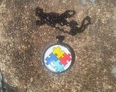Autism Awareness pendant in black, with matching necklace