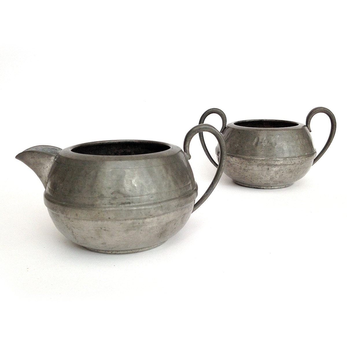 A vintage Pewter creamer and sugar bowl from 1930s