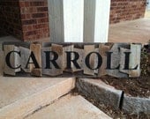 Personalized Family Name Sign on a rustic random wood canvas