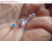 25% OFF Swarovski 5301 Faceted Bicone, Rosewater Opal AB, 4mm - 18 loose beads per package (much lovelier than my photos show...)