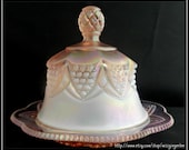 Vintage pink opalescent depression iridescent carnival glass covered butter or cheese dish with scalloped edges, domed lid with handle.