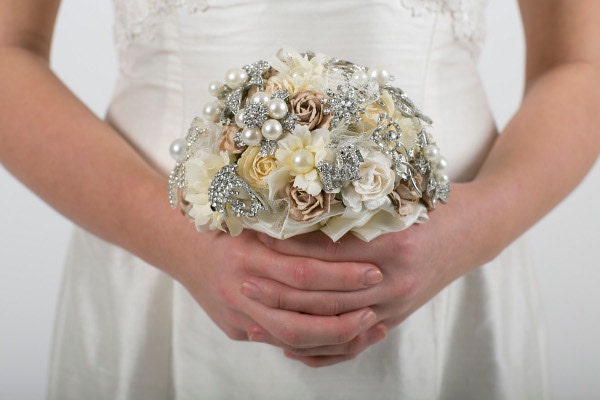 A crescent-shaped vintage bridal bouquet in ivory and mocha