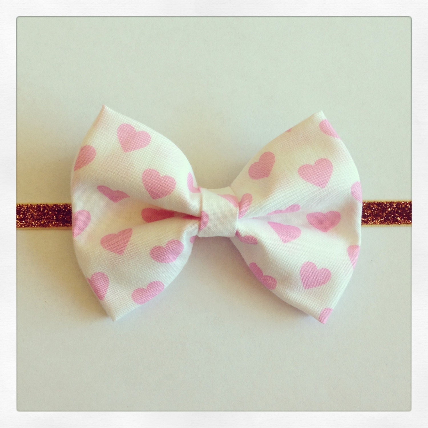 Baby bow- pink hearts fabric and wool felt bow headband