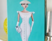 Vintage fashion, woman in 1950's pencil dress with hat and long white gloves.