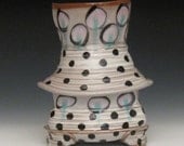 polka dotted pattern vase with pink and green glazed circles